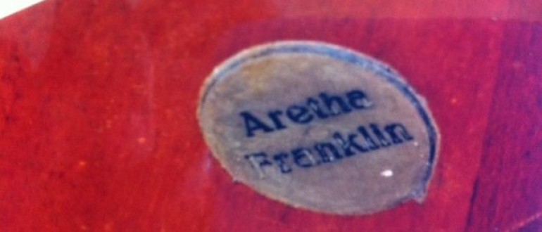 Wood engraved with "Aretha Franklin"