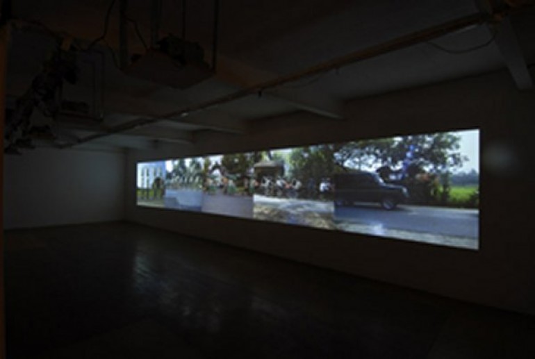 A film about climate change being projected onto the walls