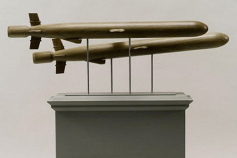A sculpture with two torpedo-like shapes