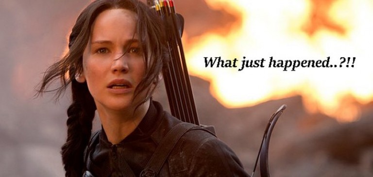 Katniss Everdeen from The Hunger Games with the caption, 'What just happened..?!!'