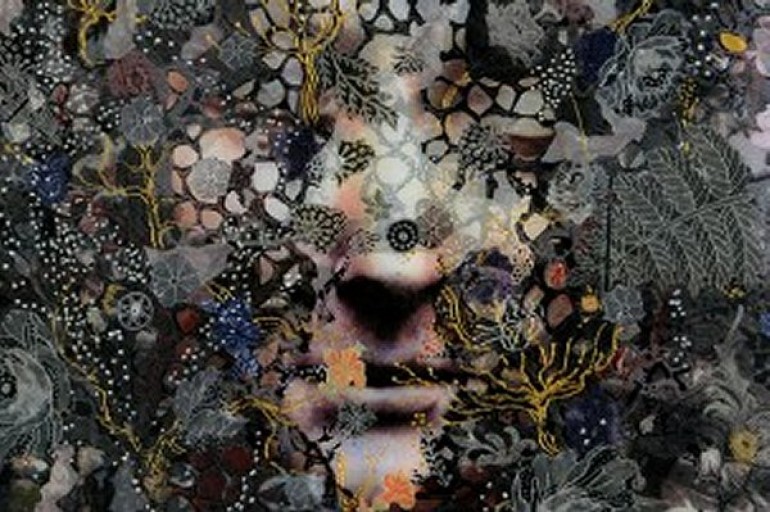 A face emerging from a dark floral background